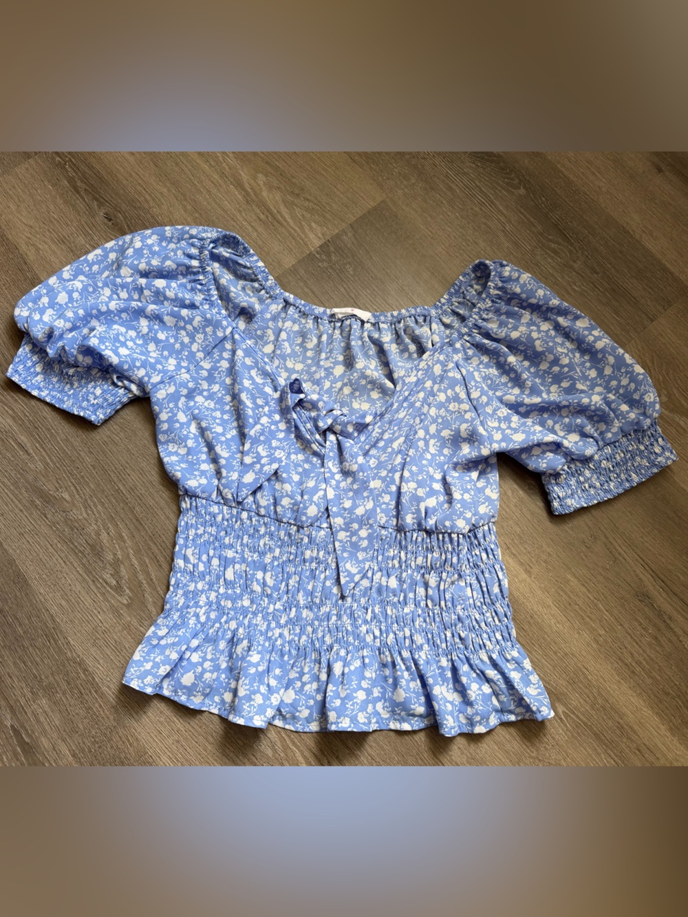 Sienna Sky floral smocked blouse with puff sleeves